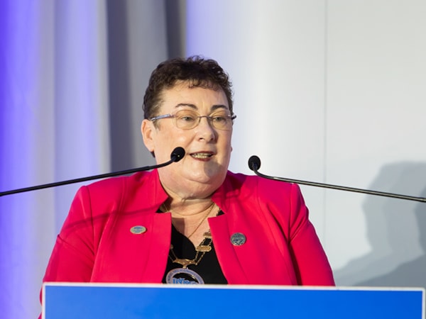 INMO president Caroline Gourley speaking at podium ADC 2025